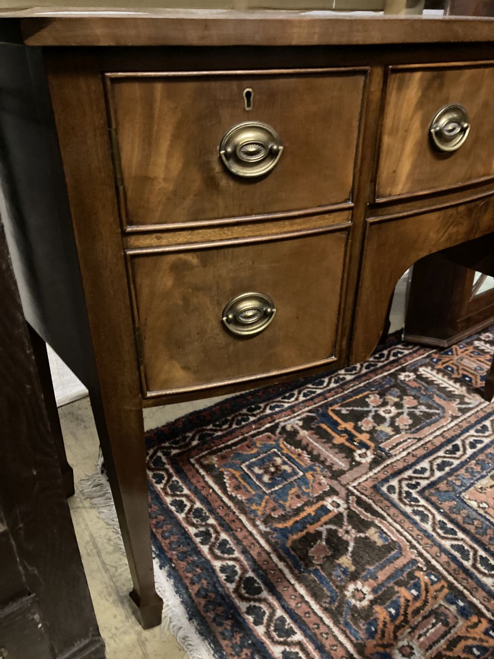 A George III style mahogany bow fronted sideboard, width 106cm, depth 53cm, height 84cm